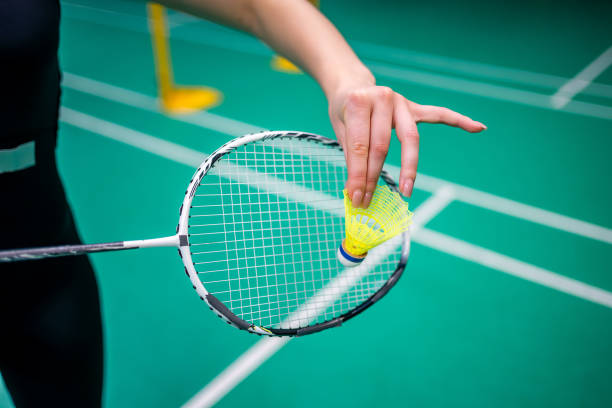 istock Close up view of racket and shuttlecock, practicing serve before playing in badminton on inside court 2183500849