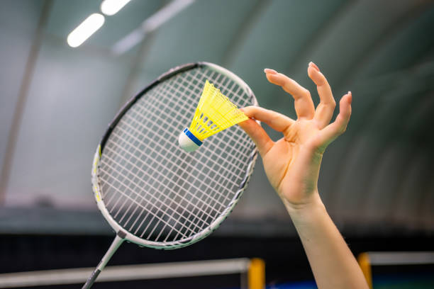 istock Close up view of racket and shuttlecock, practicing serve before playing in badminton on inside court 2183500852