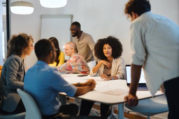 istock Diverse group of people talking about new projects during business meeting 2183504961