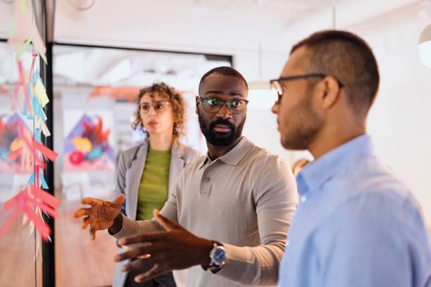 istock Modern people discuss something on a business meeting 2183505226