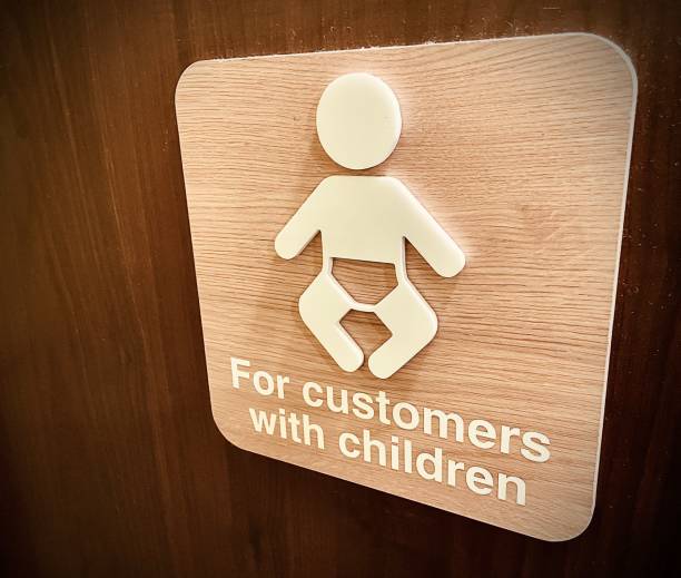 Baby changing children signage on door