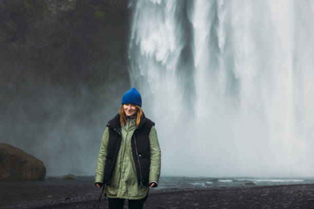 istock Happy Traveller Admiring Unbelievable Landscape with Waterfall View 2183511812