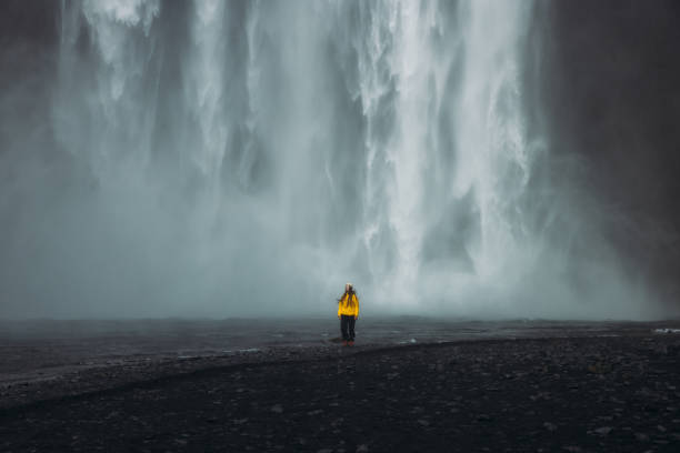 istock Traveller in Awe Admiring Unbelievable Landscape with Waterfall View 2183511881