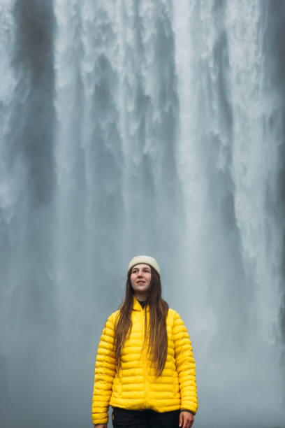 istock Woman Traveller Admiring Unbelievable Landscape with Waterfall View 2183512041