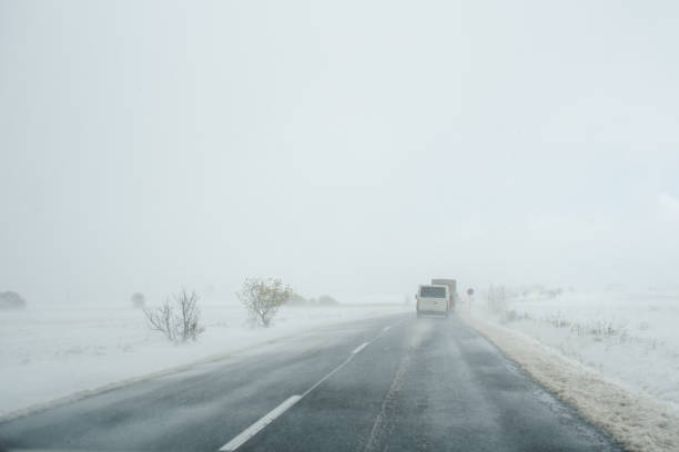 West Virginia, USA - January 23, 2023: Snowy wet day on West Virginia highway 77 that crosses the Appalican mountain range.