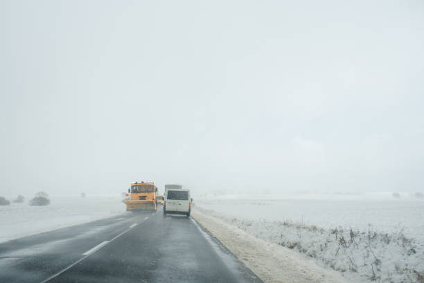 istock Snowplow clearing foggy winter road 2183513270