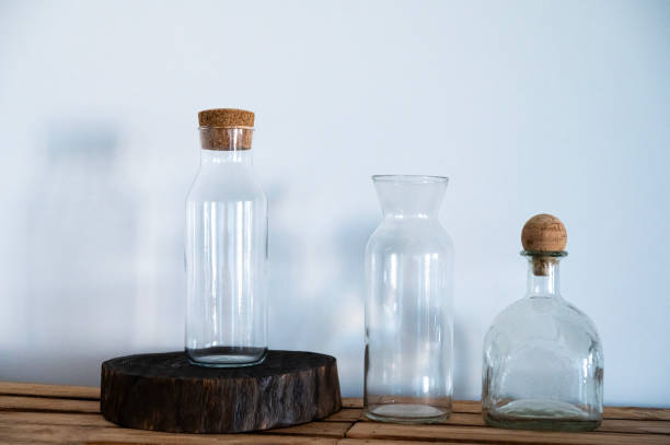 istock Textured glass bottles stand on near a white wall 2183513647
