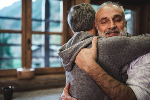 istock senior couple embracing at home for christmas 2183514685