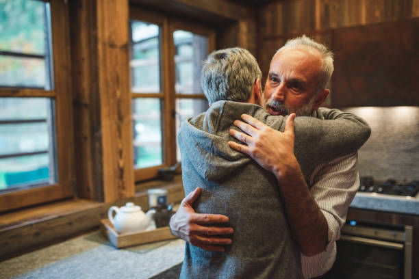 istock senior couple embracing at home for christmas 2183515341