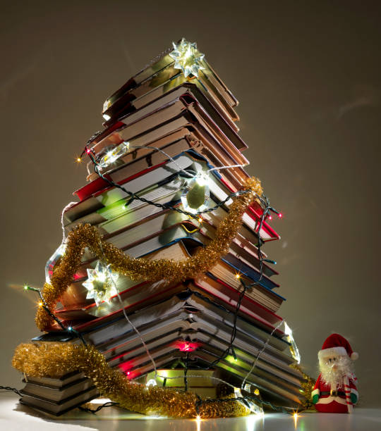 istock Still life Christmas tree with books, colored lights and Christmas decorations 2183515616