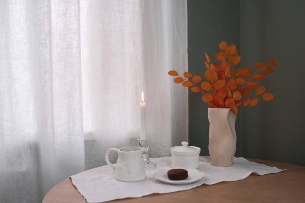 istock An Elegant Table Setting with a Candle and Floral Arrangement that radiates charm 2183516879