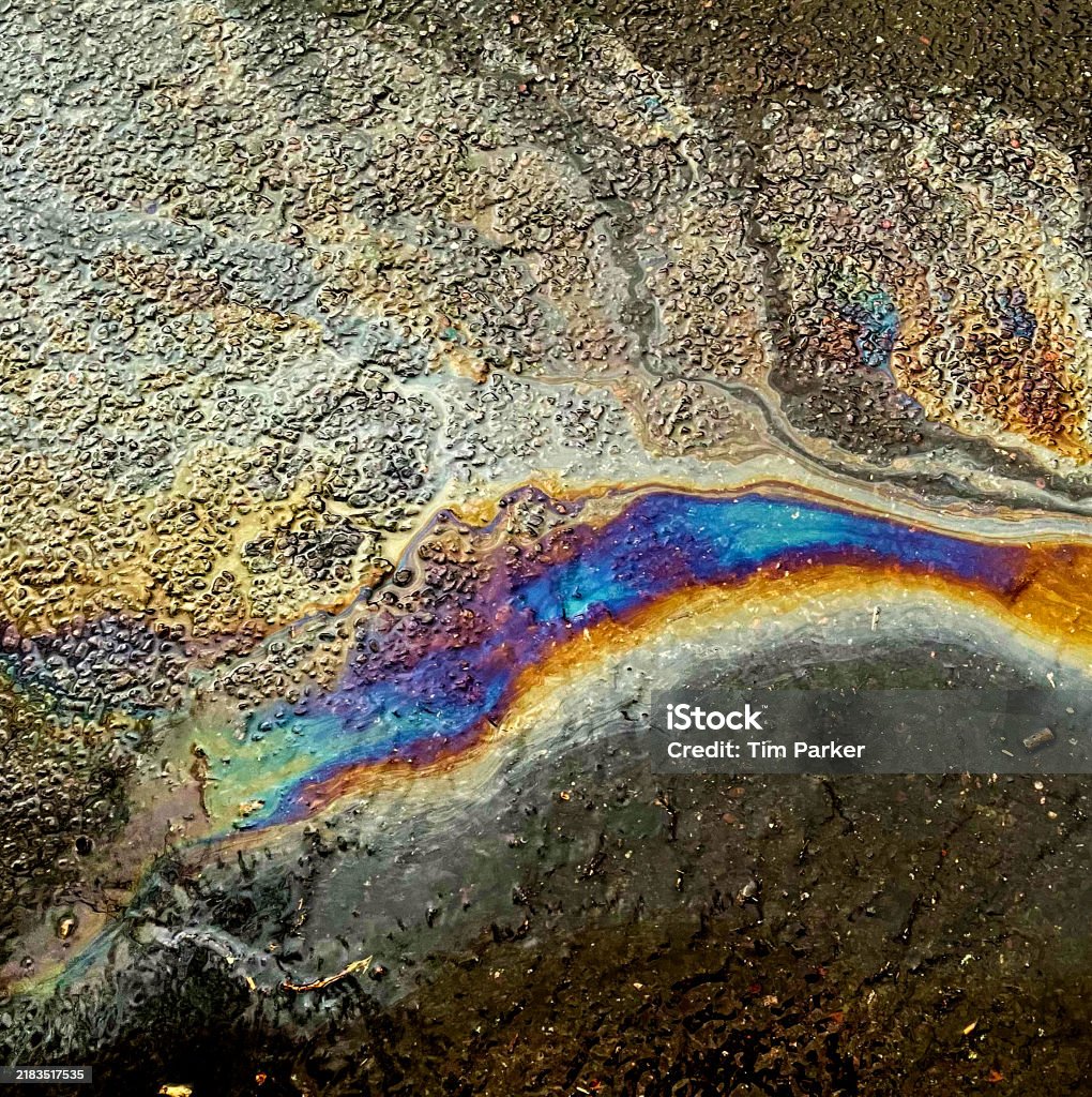 Oil Splick Oil Slick On A Road Stock Photo - Download Image Now - Floating On ...