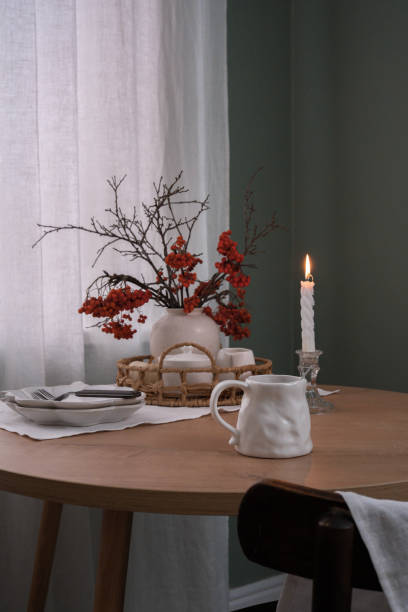 istock A Cozy Table Setting That Incorporates Beautiful Autumn Decor and Warm Candlelight Shadows 2183518050