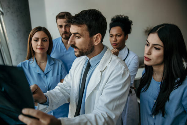 istock Doctor and his medical team working 2183518251