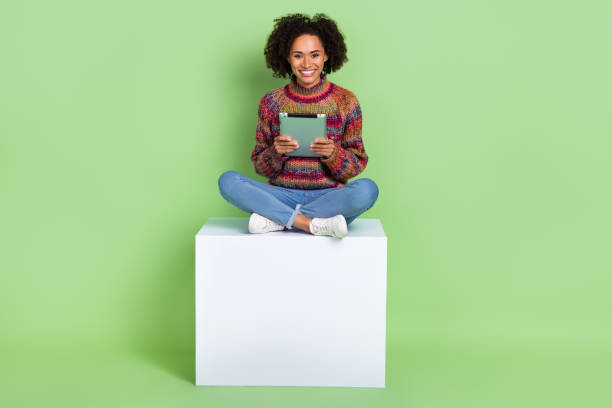 istock Photo of shiny adorable lady dressed knitted pullover chatting modern gadget isolated green color background 2183518845