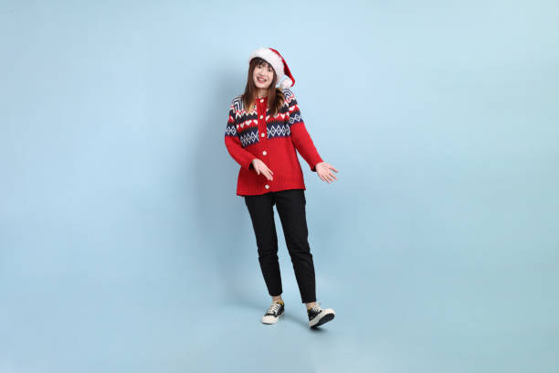 istock Woman wearing Santa hat 2183519926