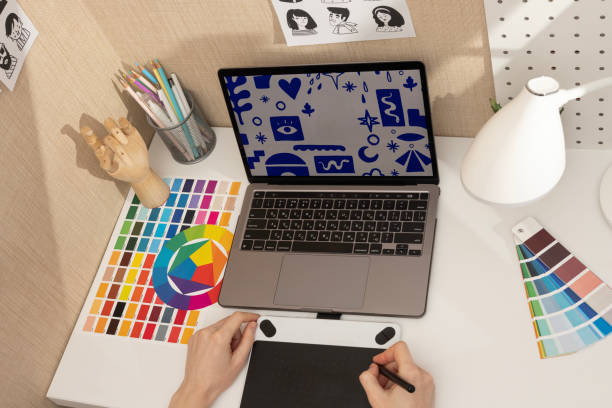 istock Professional Designer Workspace with Gadgets and Colors 2183522364