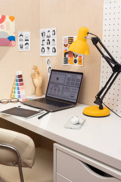 istock Fashion designer's workplace with devices in office 2183522448