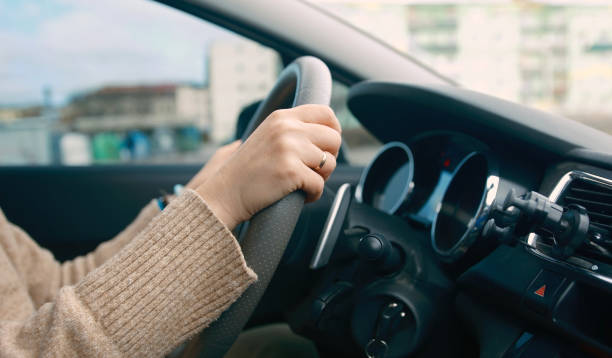istock Woman Driving Car, Turning A Steering Wheel 2183523183