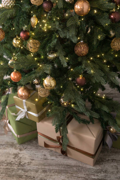 istock Bronze balls on the Christmas tree close-up. Christmas tree design decorations. The concept of celebrating New Year and Christmas 2183525307