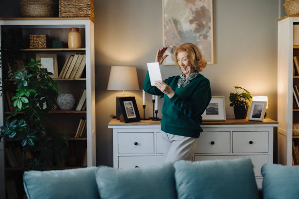 istock Senior woman using digital tablet at home 2183526174