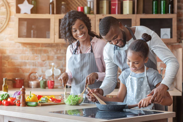 istock African parents teaching their daughter how to cook 2183526189