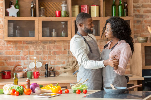 istock Black lovely married couple dancing in kitchen 2183526757