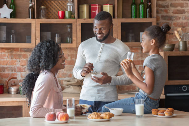 istock Lovely family having conversation during breakfast at kitchen 2183526906