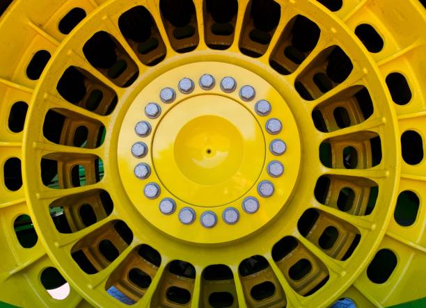 Large yellow tractor wheel detail.