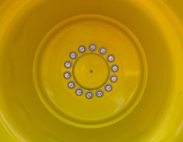 Large yellow tractor wheel detail.