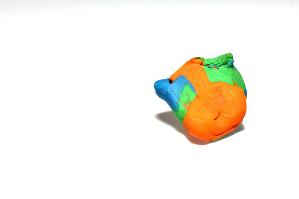 A shapeless piece of plasticine on a white background.