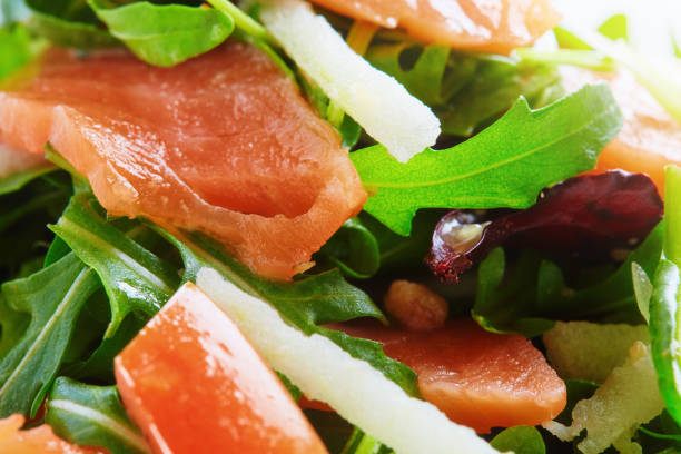 Salad of smoked salmon, rocket, tomato, onion and spring onion.