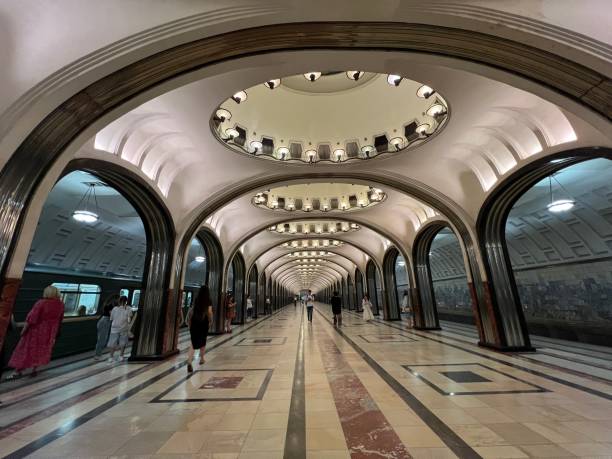 Moscow, Russia - June 15, 2024: Mayakovskaya station of Moscow Subway with people walking through the station, waiting for train