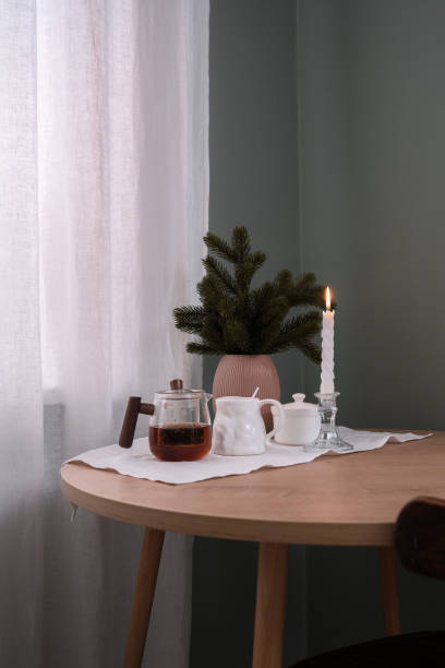 istock A Cozy Tea Setup featuring a Candle and Greenery beautifully arranged on a Table 2183533858