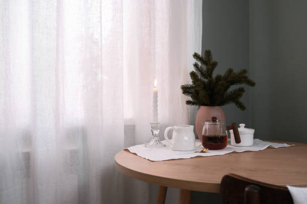 istock A Cozy Tea Setup featuring a Candle and Greenery beautifully arranged on a Table 2183534689