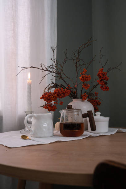 istock A Cozy Table Setting That Incorporates Beautiful Autumn Decor and Warm Candlelight Shadows 2183535332