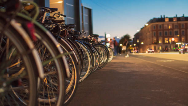 Low-angle shot of locked bikes in the street.