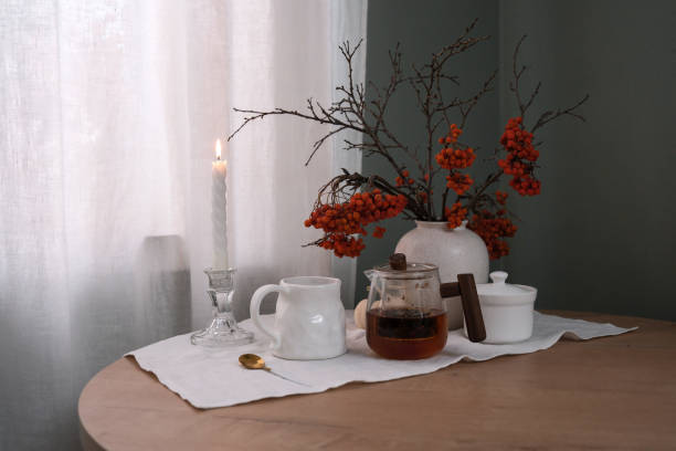 istock A Cozy Table Setting That Incorporates Beautiful Autumn Decor and Warm Candlelight Shadows 2183535513