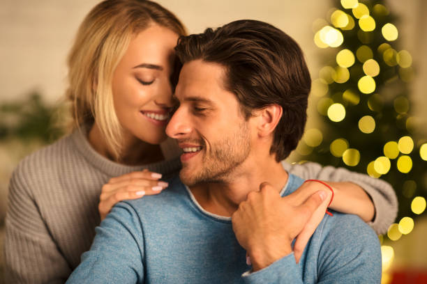 istock Romantic couple spending christmas eve together at home 2183539976