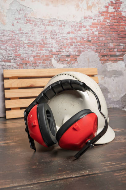 istock Red safety earphones and white helmet . 2183540131