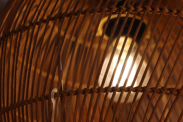 An Elegant Rattan Lamp Shade That Provides a Soft Glowing Light for Warm Ambiance