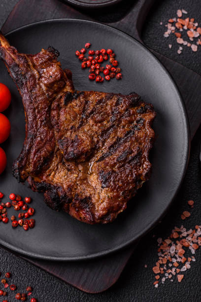 istock Grilled wagyu beef tomahawk steak with salt, spices and herbs 2183543196
