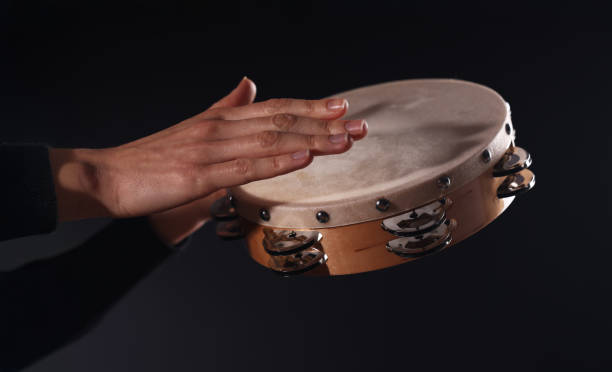 istock Drummer playing drums, different percussive musical instruments on a black background 2183544830