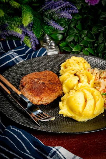 istock Minced meat cutlet served with mashed potatoes and salad. 2183551794