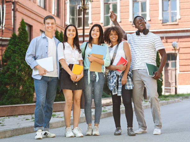 istock Group of happy students posing outdoors after lecture in university 2183552899