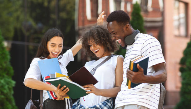 istock Overjoyed Multicultural Students Checking Exam Results And Celebrating Success 2183552927