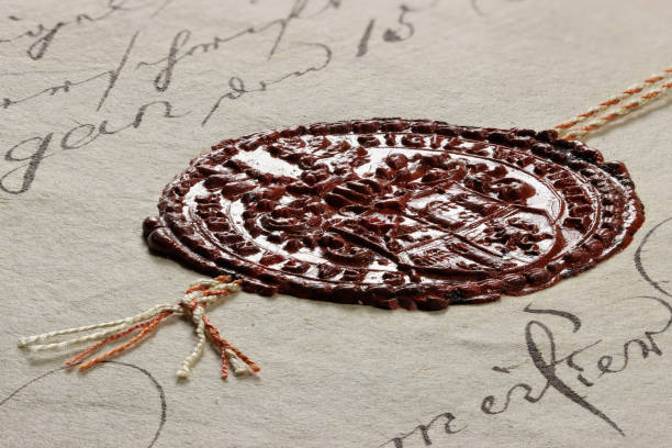 Close-up of an antique coin with intricate engravings and a weathered surface