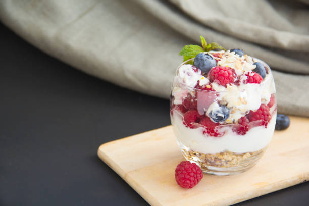 istock Healthy blueberry, raspberry and walnut parfait in a glass 2183555985