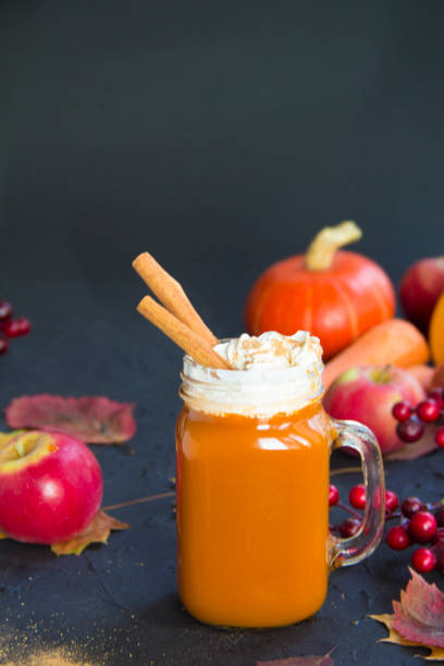 istock Halloween cocktail, pumpkin orange drink with spices 2183556220