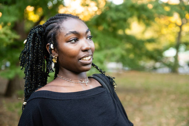 istock Young African American Woman Smiling with Uncertainty 2183556913